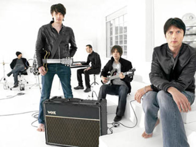 Bernard Butler (standing) is concentrating on producing